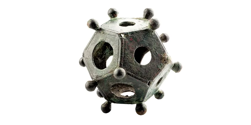 A roman dodecahedron: a 12-faced polyhedron, with each face having a central hole and each vertex having a knob