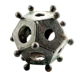 A roman dodecahedron: a 12-faced polyhedron, with each face having a central hole and each vertex having a knob
