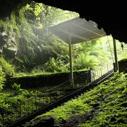 The grassy entrance to the Dunmore Caves in Ireland where a Viking Massacre may have took place. 