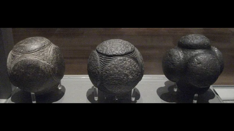 Three of the stone balls photographed at Kelvingrove Art Gallery and Museum.