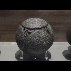 Three of the stone balls photographed at Kelvingrove Art Gallery and Museum.