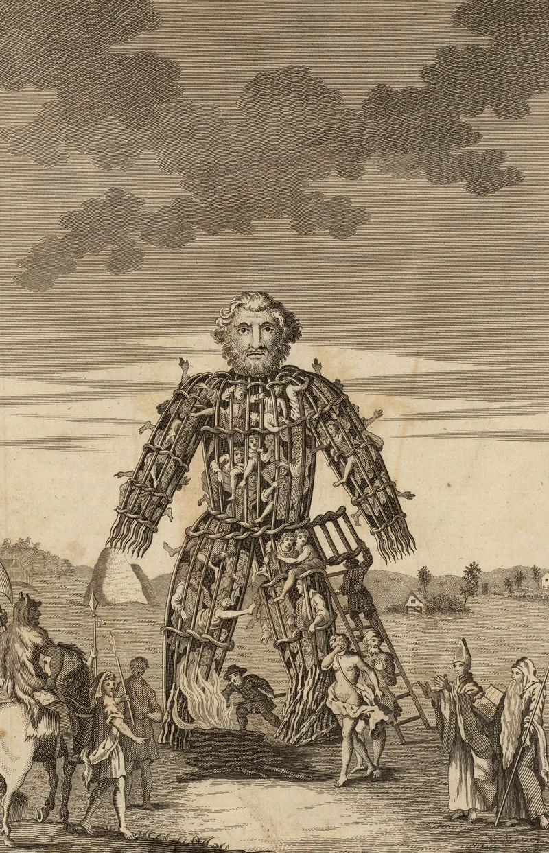 An 17th century engraving of a wicker man in a field. Its body is filled with people and a number of finely dressed individuals stand around it. 