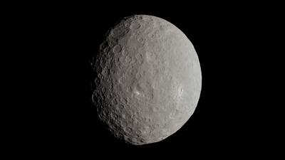 The dwarf planet is in almost full view. It is spherical with many shallow craters on its surface