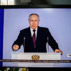 ffice desk with computer display Krym 24 station direct stream as Russian President Vladimir Putin speaks during his annual meeting with the Federal Assembly in February 2023.