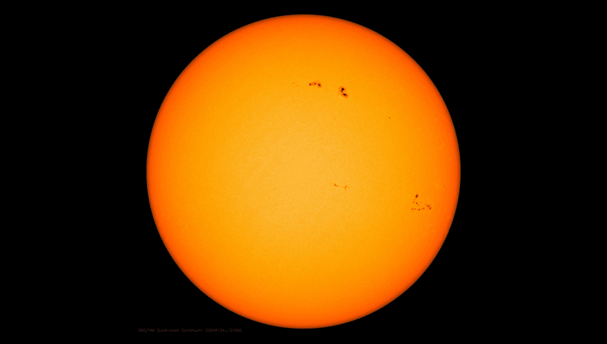 Watch Two Connected Solar Flares Explode Half-Way Across The Sun From Each Other