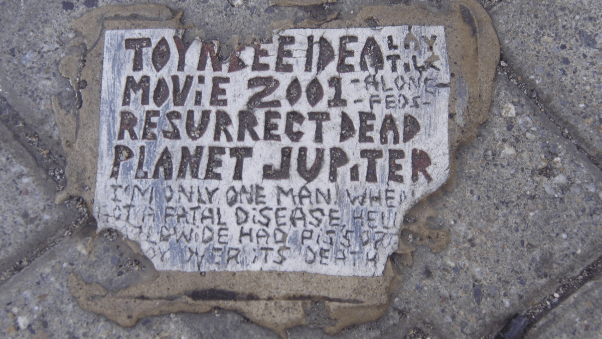 Toynbee Tiles: What’s With These Plaques About Resurrecting The Dead On Jupiter?