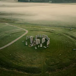 A drone shot of Stonehenge in Wiltshire, southwest England, on a misty morning.