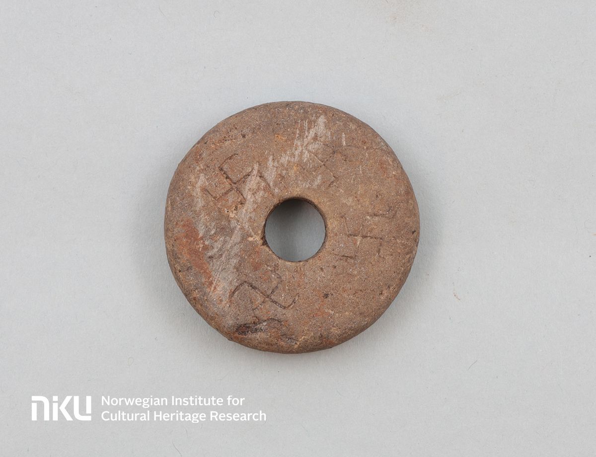 Medieval Spinning Whorl Decorated With Swastikas Uncovered In Norway