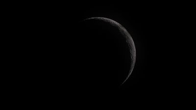 A tiny crescent of the waxing moon.