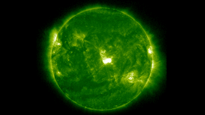A full disk image of the sun. At the very center a bright spot