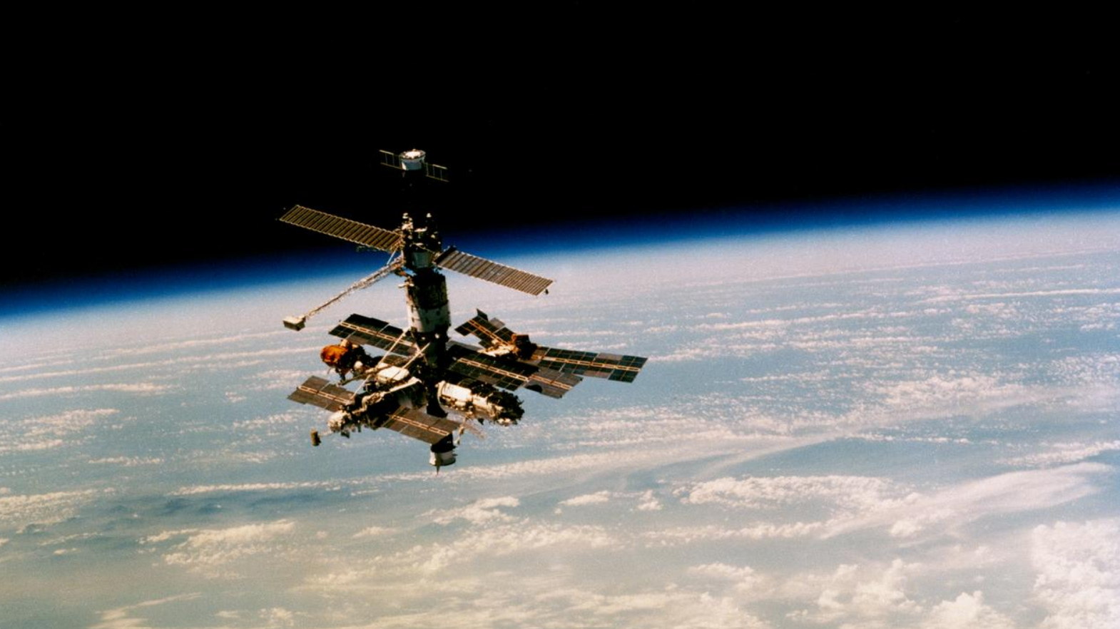 The Soviet Mir Space Station orbiting Earth in space.