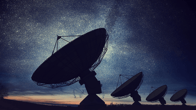 Radio telescopes pointed at the sky.