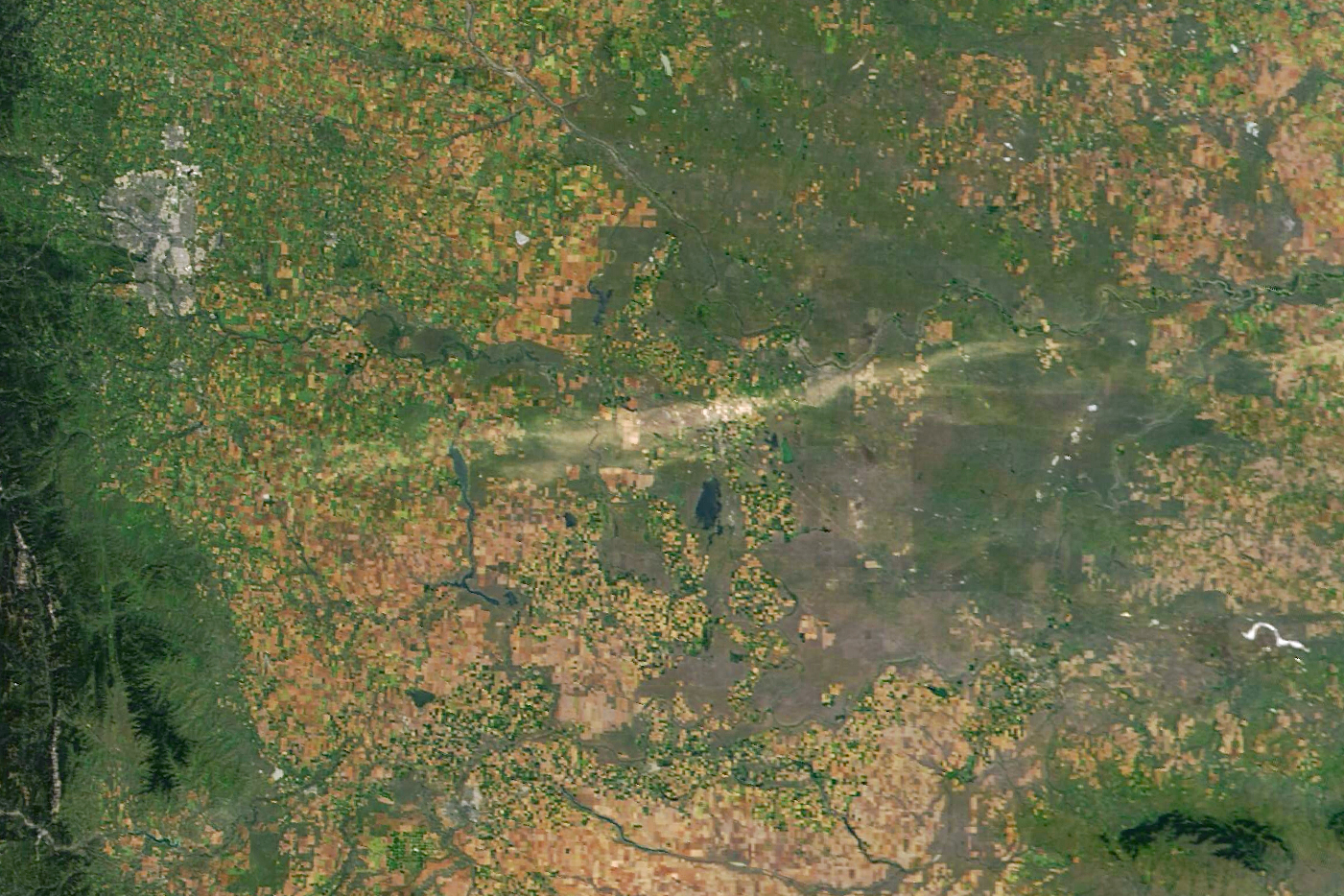 Satellite image of Alberta, Canada, taken on August 24 2025, showing a scar across the landscape left by a hailstorm.