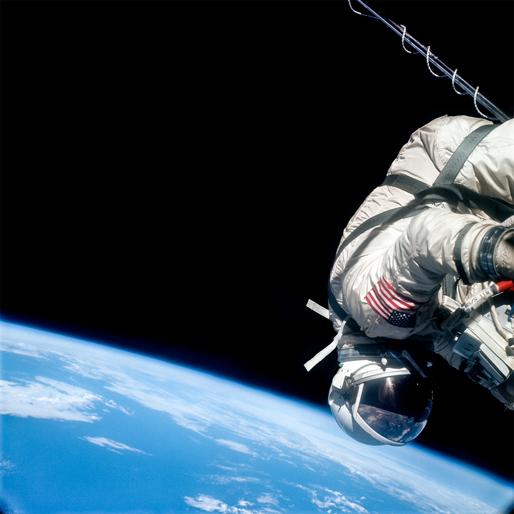 Buzz Aldrin clinging to his spacecraft