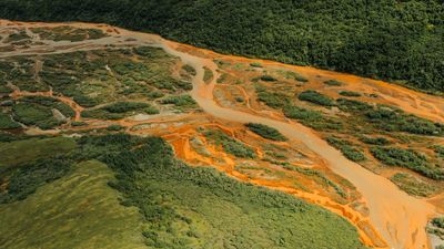 aerial view of Alaska's Salmon River, which has turned orange