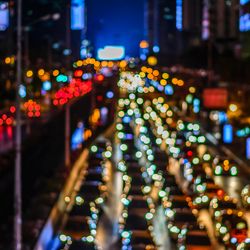 A blurry city scene of a busy highway with cars in Bangkok