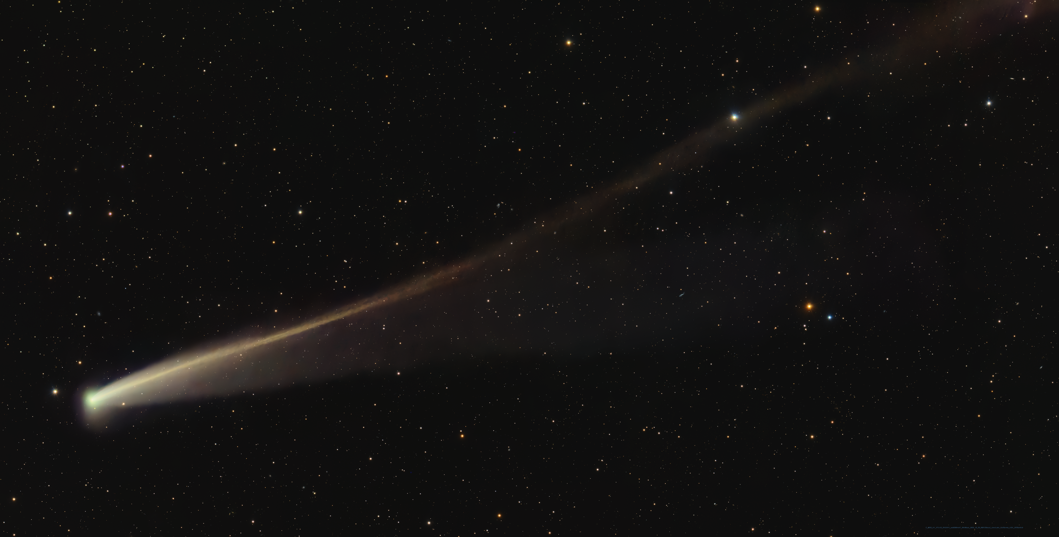 the comet has a thin green head and a long thin sinuous tail that is gold in color. the comet has a thin green head and a long thin sinuous tail that is gold in color.