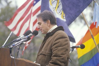 Carl Sagan speaking in front of a crowd of people.