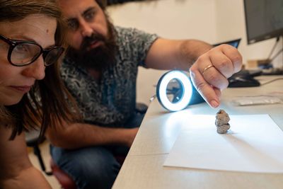 Prof. Natalie Munro and Dr. Laurent Davin with the figurine. Credit Hadas Goldgeier