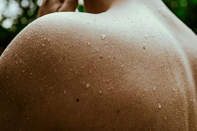 Sweat dripping down a man's back.