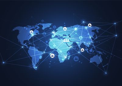 digital map of world in shades of blue with circles containing icons of people linked by lines into a large global network