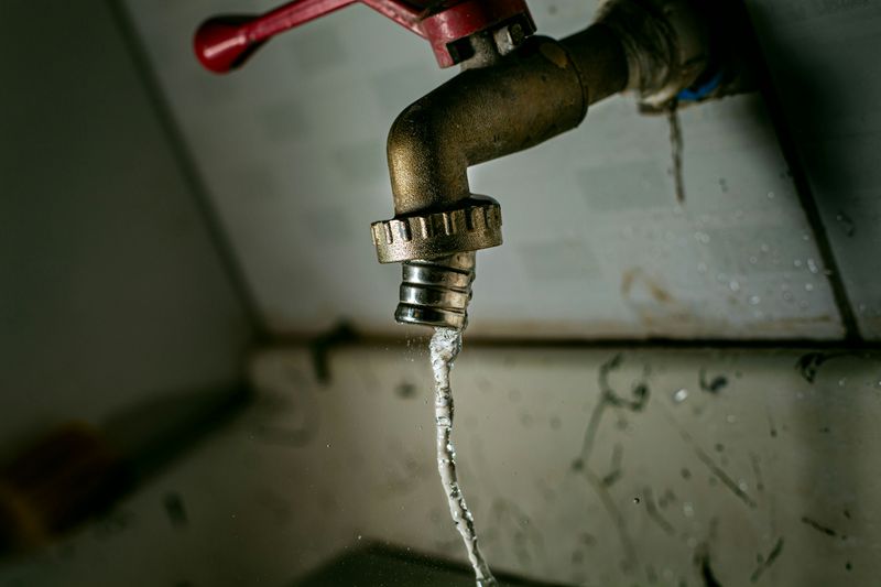 A tap with water dripping out