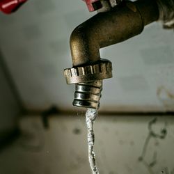 A tap with water dripping out
