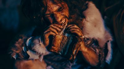 Prehistoric human eating meat