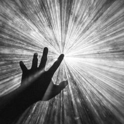 A hand reaching out to the sky.