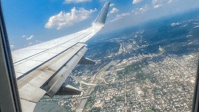 view from an airplane window during take off