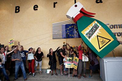 Activists take part in a protest against Biotechnology giant Monsanto, outside the European Commission headquarters in Brussels, Belgium on Jul. 19, 2017