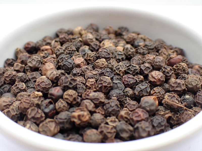 Black pepper, peppercorns, in a bowl