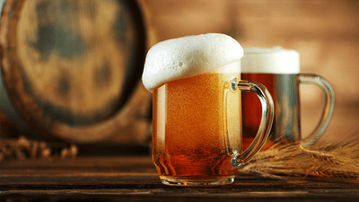 Beer, looking amber, and its head, looking white.