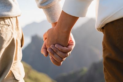 close-up of a couple holding hands