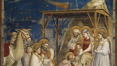 the scne depicts the three wise men visiting the holy family, above them all a bright comet is visible.