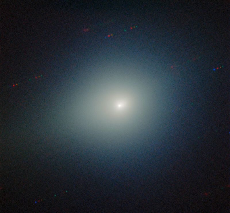 the comet is fuzzy and bright among the black background