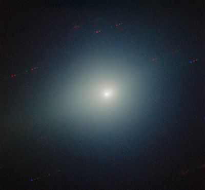 the comet is fuzzy and bright among the black background