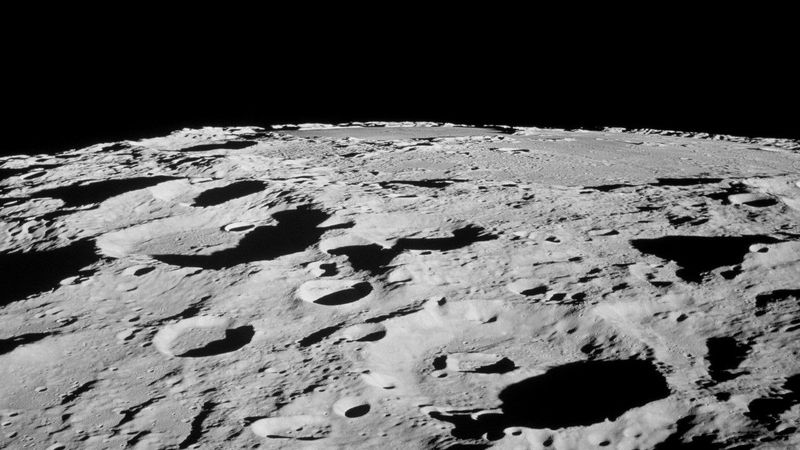 Thousands of impact craters scar the surface of the moon.