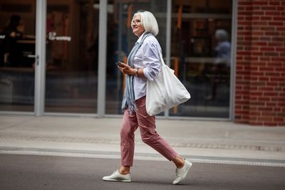 A woman walking in the street.
