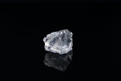 A diamond on a black surface