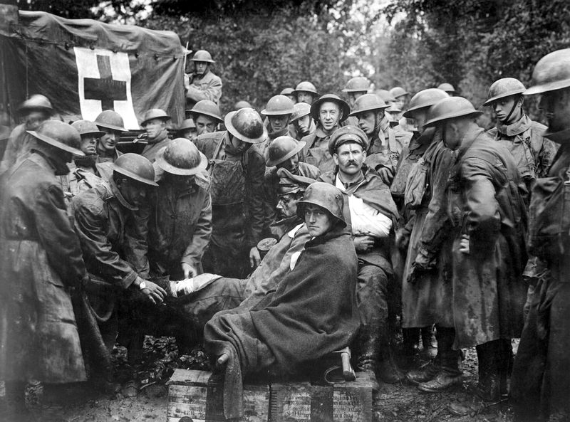 Wounded German prisoners receiving medical attention at first-aid station during WW1 in September 1918