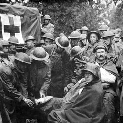 Wounded German prisoners receiving medical attention at first-aid station during WW1 in September 1918