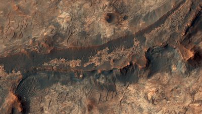 Billions of years ago, a river flowed across this scene in Mawrth Vallis.After Mars became a colder, drier place and the river disappeared, the rocky river bed remained.