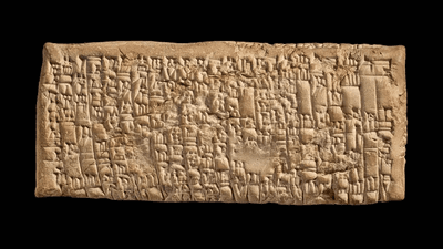  A cuneiform table on a black background.