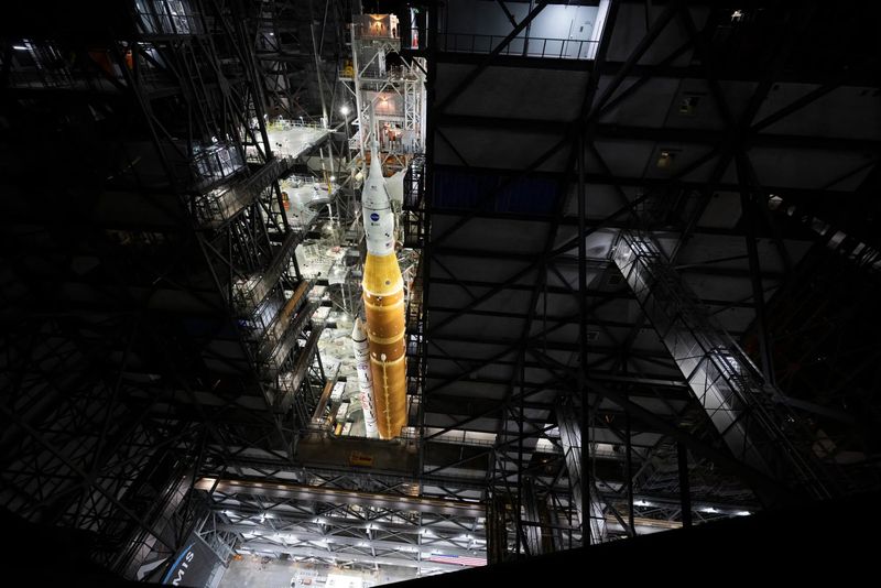 The mobile launcher with NASA’s Artemis II Space Launch System (SLS) rocket and Orion spacecraft secured to it is seen inside the Vehicle Assembly Building following the opening of the doors before rolling out to Launch Pad 39B, Saturday, Jan. 17, 2026, at NASA’s Kennedy Space Center in Florida. NASA’s Artemis II test flight will take Commander Reid Wiseman, Pilot Victor Glover, and Mission Specialist Christina Koch from NASA, and Mission Specialist Jeremy Hansen from the CSA (Canadian Space Agency), around the Moon and back to Earth.