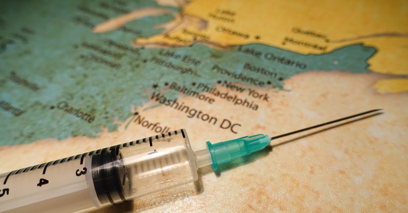 close up of syringe on a map of the eastern USA with Washington DC visible
