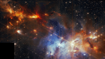 The busy image of a neubula rich in star and gas. in a dark spot of the nebula a bright reverse chevron structure is visible: the outflows from the nebula