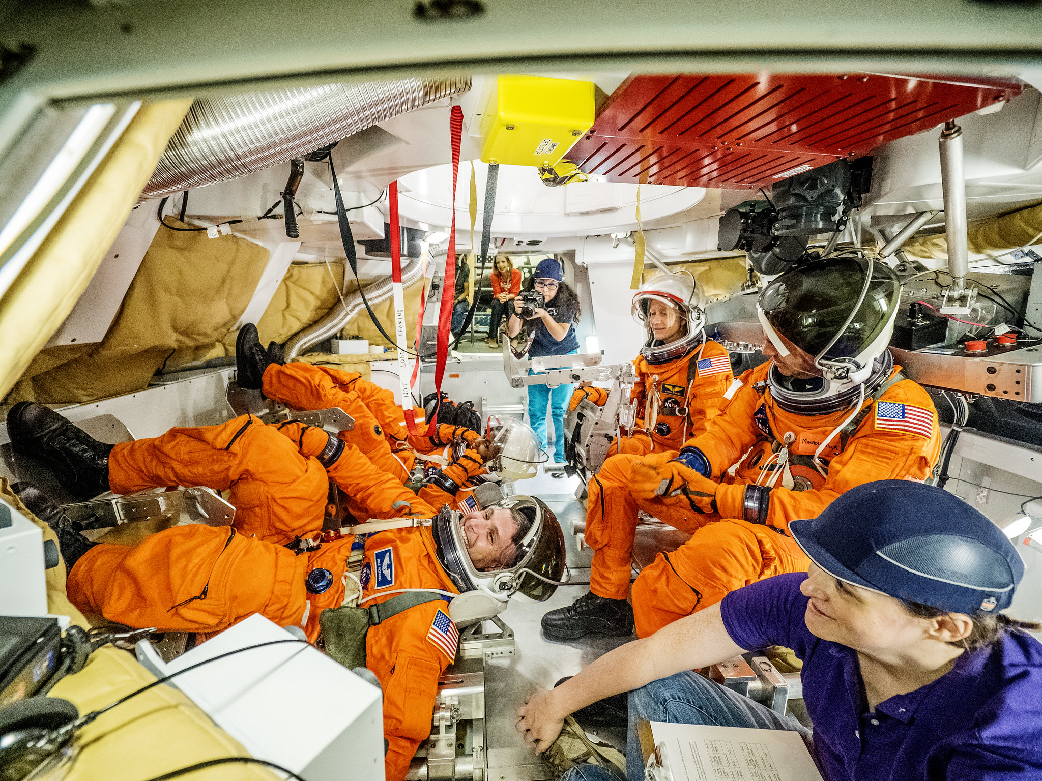 six people are in the capturle, with four astronauts seated where they should. It's a cozy fit. six people are in the capturle, with four astronauts seated where they should. It's a cozy fit.
