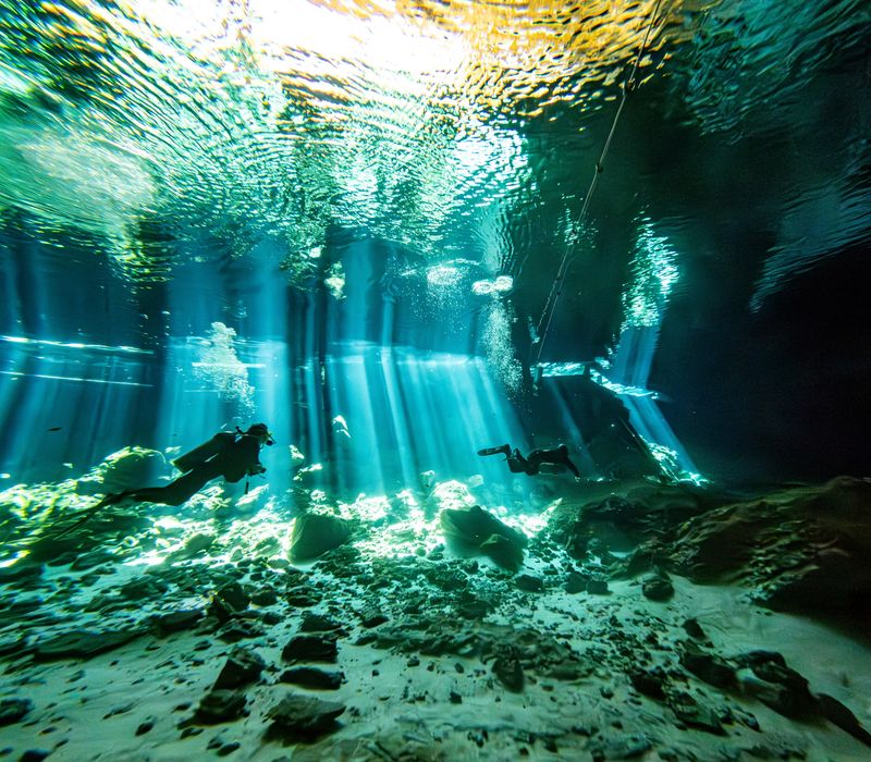 Tulum - Quintana Roo - Mexico - Feb 26th 2025: Sunlight streaming into the Cenote Dos Ojos, Tulum, Mexico