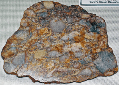 This Jack Hills rock containing quartz pebbles is from the Archean eon 3.05-2.65 billion years ago, but the zircons within it are much older.